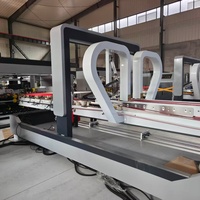 Machine automatique YANGLI pour le pliage, le collage et la couture du carton ondulé, combinée à une machine à coller et à clouer les boîtes