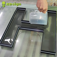 Colle acrylique liquide XDSIGN 25 kg/fût pour écrans publicitaires, pour créer des lettres claires et brillantes pour enseignes extérieures