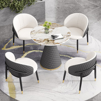 Luxuriöses Modernes Hotel-Esszimmer-Set Kratzfeste Gesinterte Steinplatte Metallbeine 4-Sitzer Ergonomische Gepolsterte Stühle