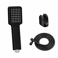 Pommeau de douche portable noir mat contemporain avec flexible tressé en acier inoxydable et support mural magnétique réglable pour l'hôtellerie
