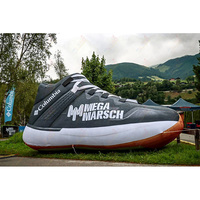 Modèle de chaussure de course géante gonflable Zhenmei en tissu Oxford 210D, installation facile pour les campagnes marketing en extérieur