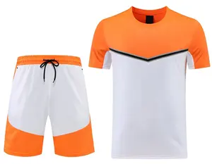 24-25 grosir potongan putih dan potongan oranye Set pakaian latihan dewasa stok pabrik pakaian olahraga anak-anak