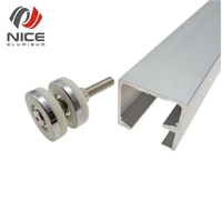 Rail de porte coulissante en alliage d'aluminium de conception moderne profilé en T avec roue à rouleaux à rainure V-U en plastique en bois