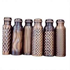 Modern Reusable Copper Water <b>Bottles</b> with Screw-On Caps and Hammered Textured Design - Product Image 1