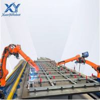 Station de soudage robotisée industrielle avec PLC et moteur pour panneaux en acier de maisons conteneurs, armoire de commande de rail de transport, torche de soudage
