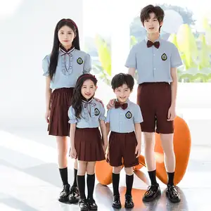 ชุดนักเรียน OEM เสื้อเชิ้ต<span class=keywords><strong>สี</strong></span>น้ำเงินปักลายพร้อม<span class=keywords><strong>กางเกง</strong></span>ขาสั้น<span class=keywords><strong>สี</strong></span><span class=keywords><strong>น้ำตาล</strong></span>และกระโปรง ชุดนักเรียนมัธยมต้น - Product Image 1