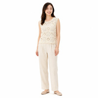 Gilet en crochet personnalisé OEM ODM pour femme, sans manches, ajouré, en maille, pull sans manches ajouré ivoire pour le bureau et les trajets quotidiens
