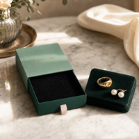 Boîte à bijoux sur mesure OEM ODM, design bicolore vert avec doublure en velours noir, ruban de traction, fabricant en gros