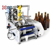 Machine d'étiquetage semi-automatique de table pour tubes, bouteilles et canettes rondes de 20 à 500 ml, pour mini-laboratoires, du fabricant Bench Manufacturer