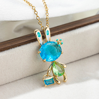 Collier pendentif lapin plaqué or étincelant avec pierre bleue, perles émail vert et turquoise, ovales facettées, cadeau bijoux pour femme