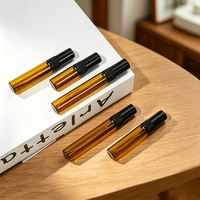 Vente en gros de mini flacons cylindriques de luxe en verre ambré pour échantillons de parfum, atomiseurs à bouchon à vis, 2ml 3ml 5ml 10ml, emballage vide pour huiles