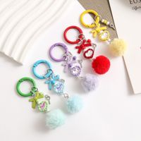 Porte-clés mignon en forme de cœur avec nœud et pompon en fourrure, breloque de sac en peluche colorée, accessoires de chaîne de téléphone pour la décoration de sac à dos