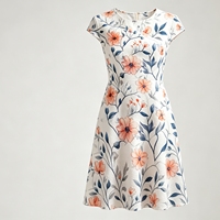 Tissu imprimé floral pêche doux, motif vigne, fleurs orange romantiques et feuilles grises, idéal pour les chemisiers d'été et les linge de maison élégant