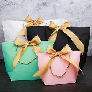 Wholesale Cardboard Bags Packaging Pink Black Green Kraft Shopping Paper Gift Bags With Ribbon Handle For Small Business