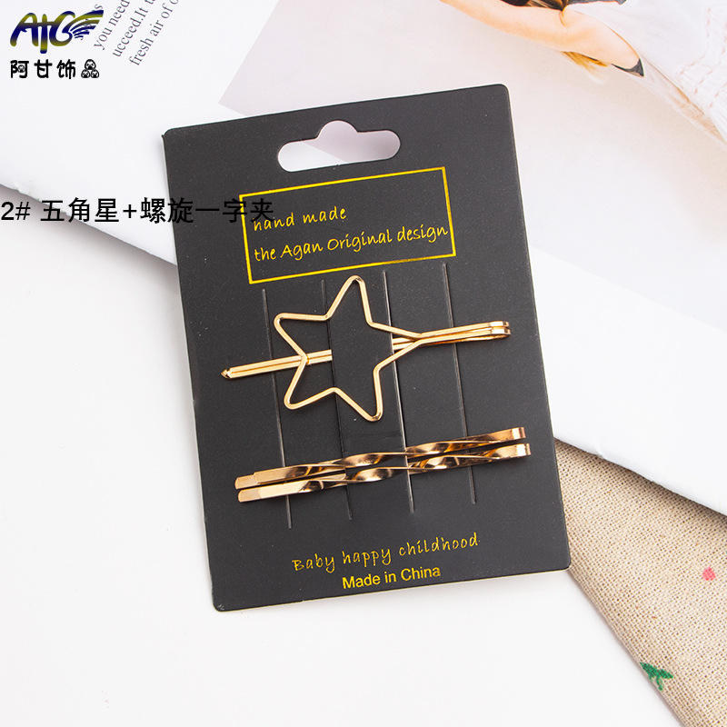 2 étoiles à cinq branches + clip spirale d'un mot