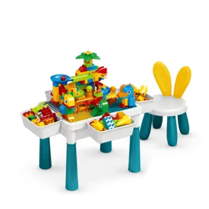 Yeni tasarım oyun evi 2 in 1 çocuk plastik aktivite çalışma masası DIY 105 adet tuğla yapı taşları masa sandalye