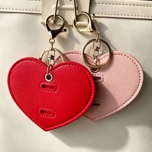 Fashion PU Leather Heart-Shaped Promotional Keychain Travel Sunglasses Clip Holder Hanging Bag Charm Portable Eyewear Storage - Product Image 3