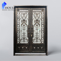 Porte d'entrée américaine en fer forgé avec décorations symétriques et verre de confidentialité