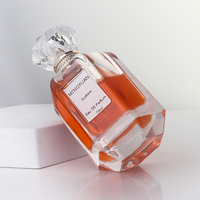 Flacon de parfum hexagonal en verre transparent de luxe 70 ml avec pompe pulvérisatrice, bouchon en acrylique sérigraphié, emballage en boîte cadeau cylindrique