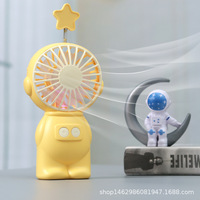 Nouveau mini-ventilateur portable astronaute de dessin animé, 1 vitesse, éclairage coloré, moteur sans balais, alimentation USB/batterie, commande par bouton