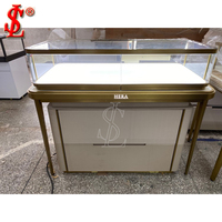 Table de présentation de bijoux en métal doré de luxe, vitrine moderne en verre avec tiroir verrouillable pour boutique, mobilier de vente au détail