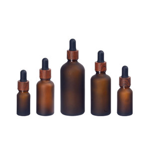 5ml 10ml 15ml 20ml 30ml 50ml <strong>Glass</strong> Frosted <strong>Amber</strong> Essential Oil Eye Liquid <strong>Bottle</strong> with Dark Brown Wood Grain Dropper Cap - Product Image 1