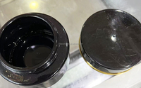 Bouteille de crème en verre noir avec pot de crème cosmétique ligne d'or emballage séparé