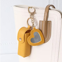 Étui à rouge à lèvres en cuir PU léger avec miroir en forme de cœur, pochette durable pour baume à lèvres, maquillage de voyage pour femmes