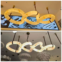 Lustre en résine imitation albâtre, luminaire suspendu en forme d'anneau torsadé, lampe LED d'art moderne, éclairage intérieur créatif pour villa, hall d'entrée, restaurant.