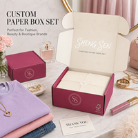 Maßgefertigte Verpackungsboxen mit Farbigen Logos Rosa Weiß UV-Beschichtung Kleidung Schneebirnenpapier Verwendet für Versandboxen für Kleidung