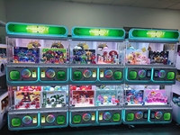 Distributeur automatique de jouets commercial à 4 compartiments, compatible avec les boîtes cadeaux et les panneaux d'autocollants personnalisés, pour sites d'amusement intérieurs, vente en gros
