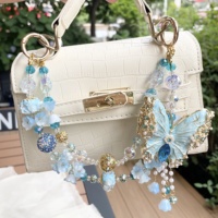 Cadena para teléfono móvil con diseño de mariposa, doble cadena, hecha a mano con cuentas, joyería de alta gama, colgante de borla de perlas, venta caliente transfronteriza