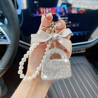 Breloque de sac de style créateur, petite pochette parfumée, autocollant style Ins, cordon à diamants, porte-clés de sac à main avec diamants simulés, design de niche