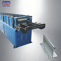Machine de formage à froid pour rail inférieur de porte à enroulement en acier avec certification CE pour systèmes de volets roulants au Nigeria, service OEM