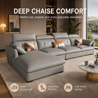Canapé d'angle gris aspect cuir avec chaise longue, dossier capitonné et appuie-tête rembourrés pour salon, hôtel, appartement