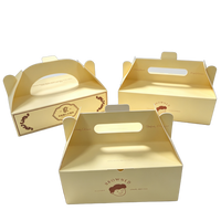 Boîte en carton dorée effet estampage à chaud, emballage de luxe haut de gamme pour pâtisseries, pains et friandises avec poignée