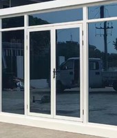 Maison conteneur préfabriquée sur mesure en kit avec mur-rideau en verre de 20 pieds pour bureau, salle d'exposition et usage commercial