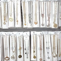 Vente en gros d'usine, bracelets, colliers et boucles d'oreilles tendance de marque de luxe pour femmes, zircon, couleurs mélangées, acier inoxydable