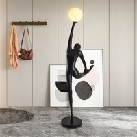 Lampe sur pied LED moderne en verre noir avec sculpture de figure humaine, vente en gros directe d'usine pour la décoration de la maison, des hôtels et des halls d'entrée