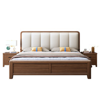 Lit double moderne et simple en bois massif couleur noyer, nouveau style chinois, pour chambre principale, avec tête de lit capitonnée en cuir et rangement intégré.