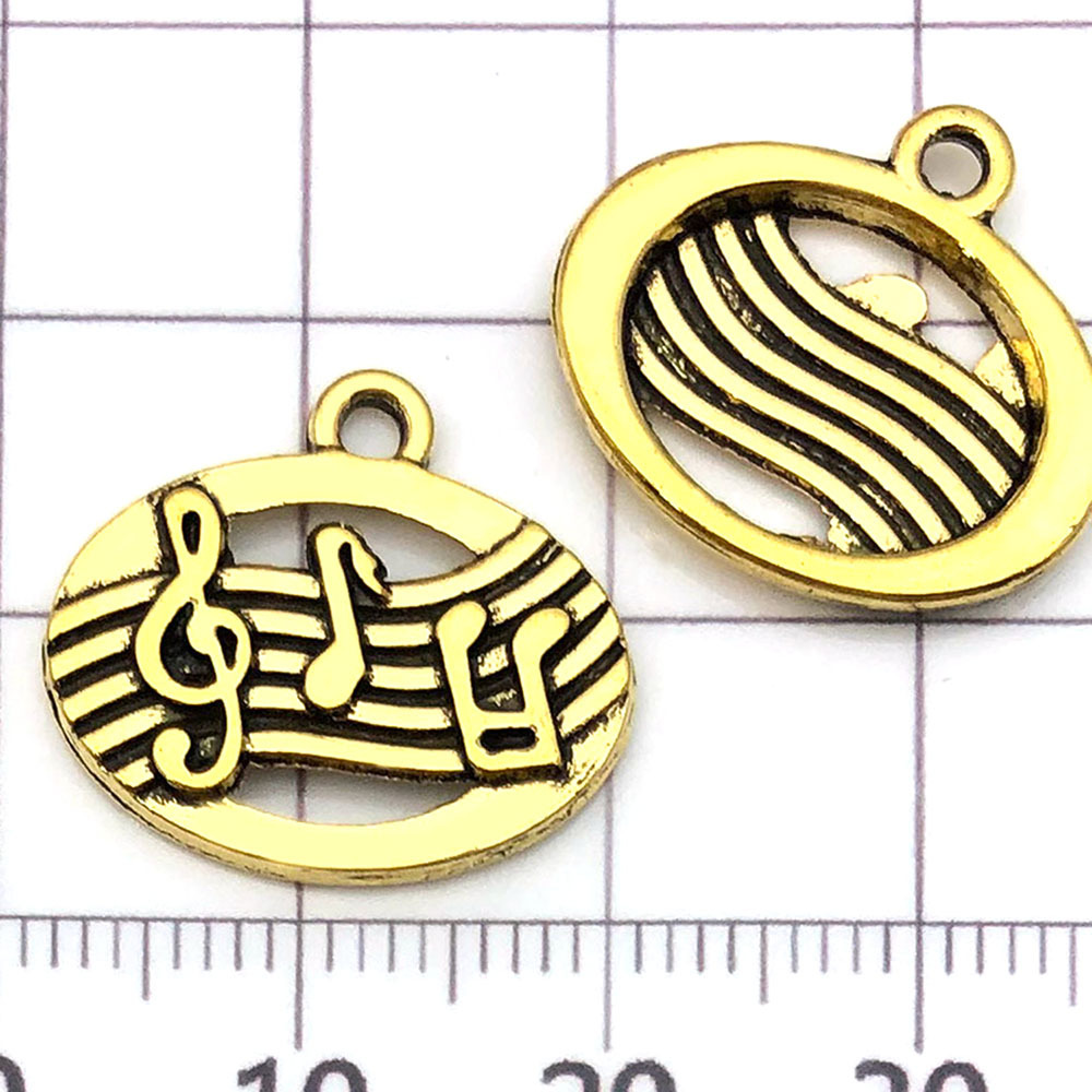 Une note de musique ancienne en or - 1,4g - 17*19mm - 20877
