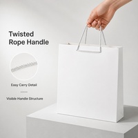 Sac cadeau en papier blanc avec poignées en corde torsadée, emballage de vente au détail pliable pour événements, boutiques et présentation de marques