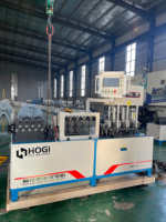 Machine à plier le fer plat HOGI entièrement automatique et intégrée : alimentation, redressage, poinçonnage, pliage, découpe