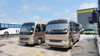 Mini-bus de luxe confortable à 29 places, moteur diesel D4GA, transmission manuelle, bus Coaster d'occasion
