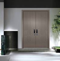 Porte d'entrée double haut de gamme en aluminium moulé, style Art déco, cercles métalliques concentriques, personnalisation exclusive pour projets.