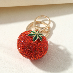 Meilleure vente : Boutons de manchette de luxe léger entièrement ornés de strass, motif kaki, pour filles, avec pendentif porte-clés de sac de voiture en forme de fruit, sensation haut de gamme, style sportif - Product Image 2