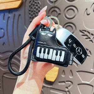 Nouveau Porte-clés en Cuir 2026 avec <span class=keywords><strong>Guitare</strong></span> et Chat, Breloque Piano, Pendentif de Sac Créatif et Adorable pour Filles - Vente en Gros - Product Image 4