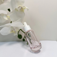 Flacon compte-gouttes en verre rose transparent personnalisé avec logo, forme cylindrique minimaliste, pour cosmétiques de voyage