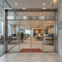 Porte d'entrée commerciale à cadre fin gris anthracite avec capteur et contrôle d'accès intelligent pour bâtiment de bureaux à fort trafic, sécurisée