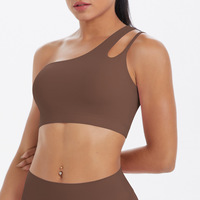 Sujetador deportivo de moda irregular sin aros con una sola tira, de tela suave con patchwork y espalda recortada, para fitness y entrenamiento.